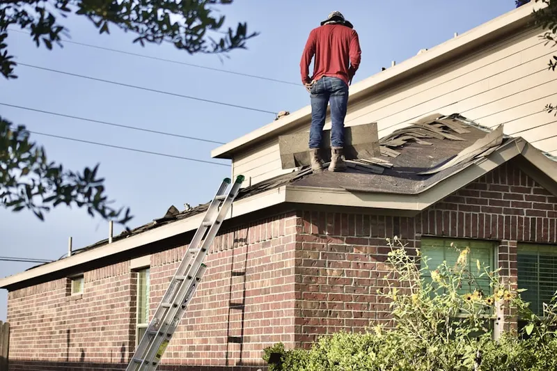 Professional roofer working on a residential roof in Pepper Tree Farms